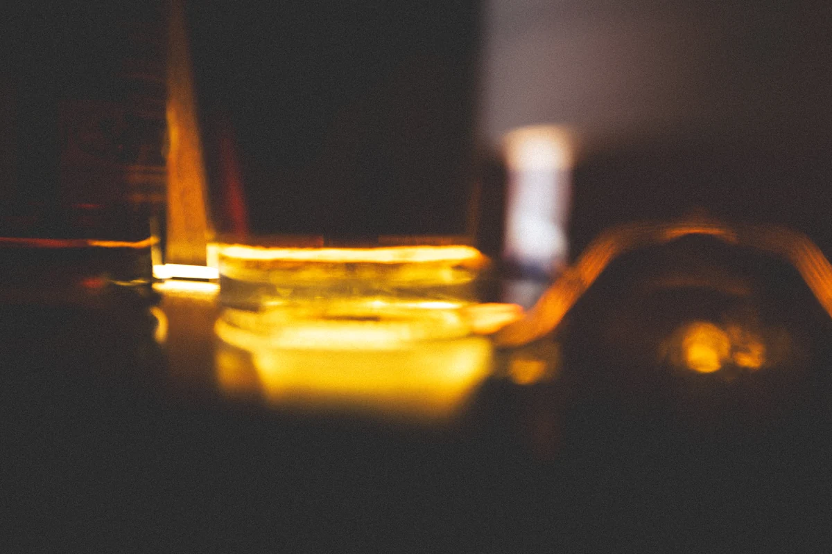 An abstract trail of golden light in a dark interior